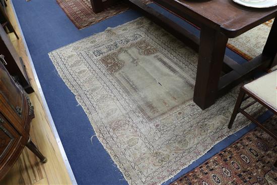 A Bokhara red ground rug and two Persian rugs (worn)